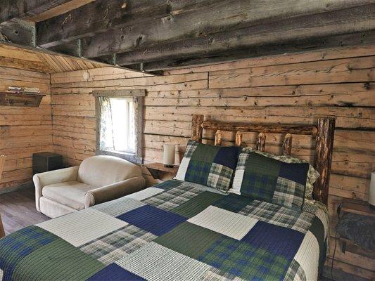 The Raven Cabin shows the hand-crafted log beds and new linens found in all our guest cabins.