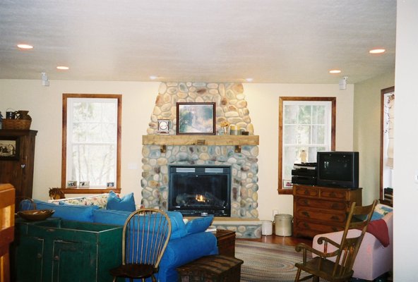 Riverfront Home River Rock Fireplace in Living Room