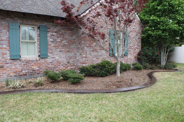 Coffee/walnut colored Concrete curbing with slate texture.