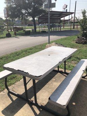 The picnic table provided and the residential mailboxes