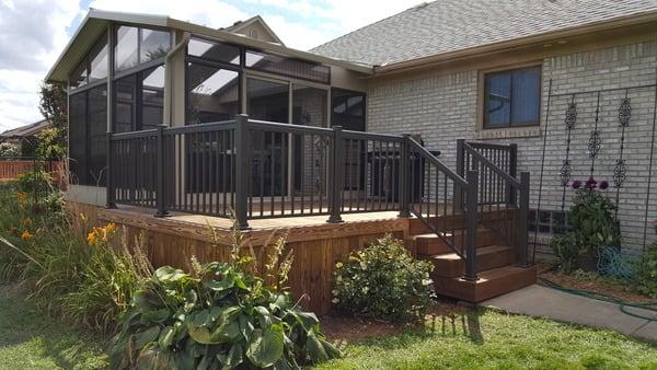 The Dura Holz Thermally Modified Decking shows of well with the new sunroom added to this home. Still wanting a place outside we built the s