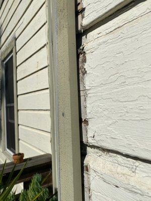 The corner of our exterior that literally wiggles and isn't flush to *again* the rotting wood they left.