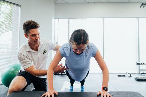 Client working out with trainer