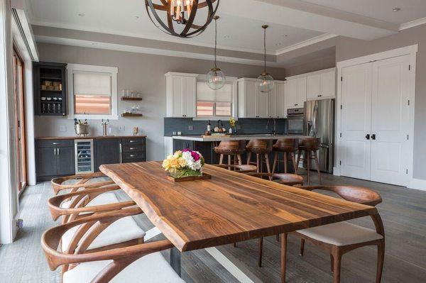 Open floorplan kitchen with contrasting island and mini bar.