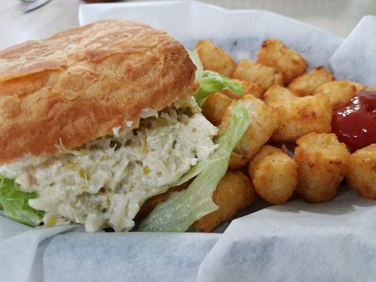 Chicken salad on croissant roll with TOTS