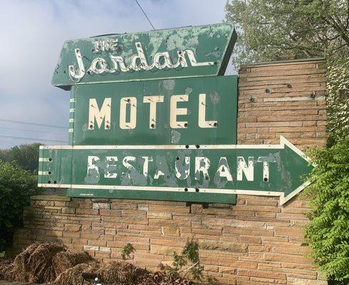 Outside Jordan Motel sign near road