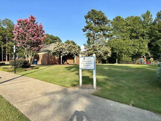 Back view of park area including facilities/bathroom building.