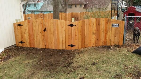 This is a 5' tall arched cedar fence in overland park.