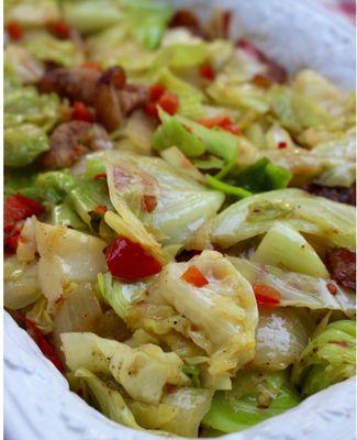 Fried cabbage onion and peppers goes with Jerk Chicken.