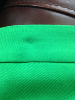 New $90 skirt returned with large pin holes in the top, which the cleaner tried to scratch out with her fingernail.