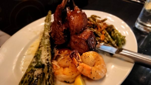 Lamb with asparagus,  green beans,  and grilled shrimp added on