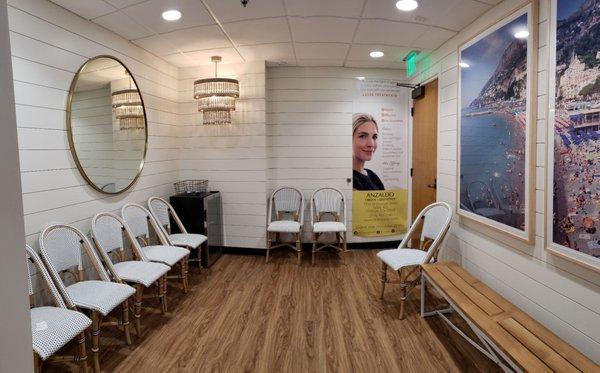 Oh you fancy, huh? Beautifully remodeled waiting room,  complete with refreshments. However, brace yourself for ads targeting ur body image