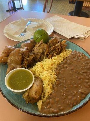 The Carnitas Plate( Slow Roasted Pork) with the usual suspects beans and rice with fresh homemade tortillas