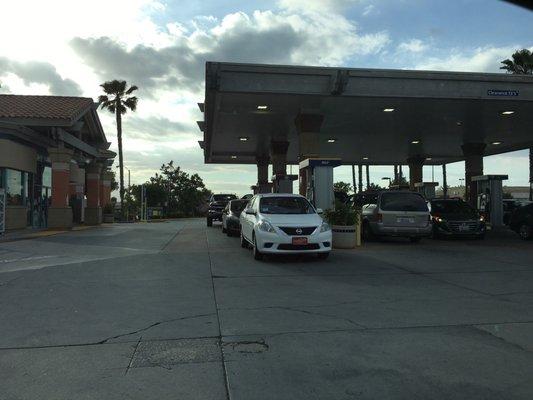 The car wash is located behind the convenience store.