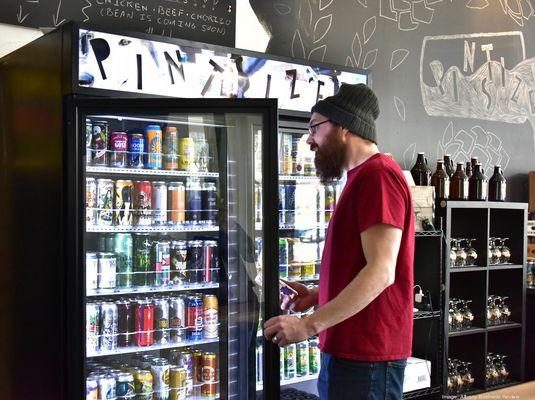 Over 100 cans available to drink at the bar or take home as singles or mix 4-packs. Photo from the Albany Business Review (goo.gl/AE9V4p)