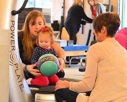 Our caring staff helping one of our little patients