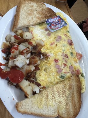 A Denver Omelette with house potatoes.