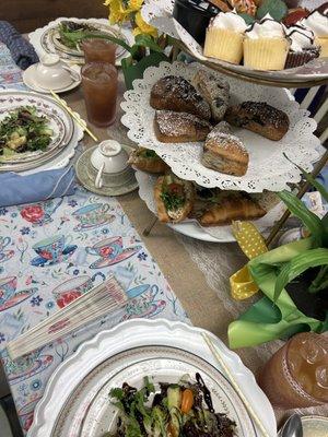 Three tier- bottom sandwiches, middle scones, and top sweets