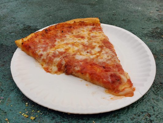 A slice of cheese pizza from Bills Pizza in Old Orchard