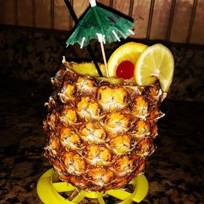 Rum punch served in a real pineapple