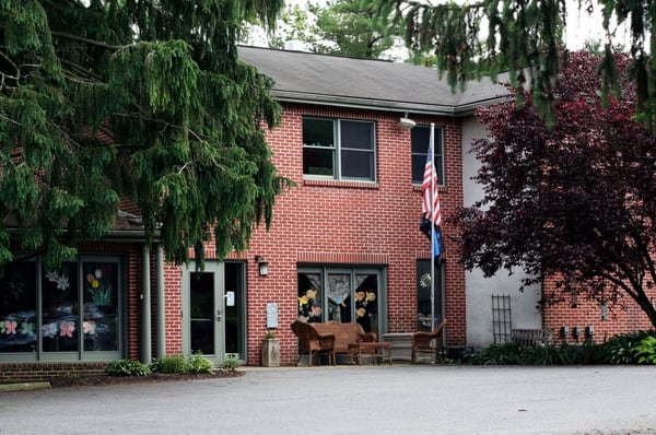 The school building offers a quiet, peaceful, shaded yard.