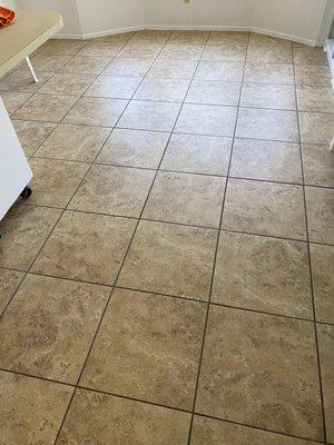 Post cleaning of grout and tile with paint and joint compound on floors.