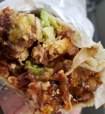 Chorizo Breakfast burrito with avocado.