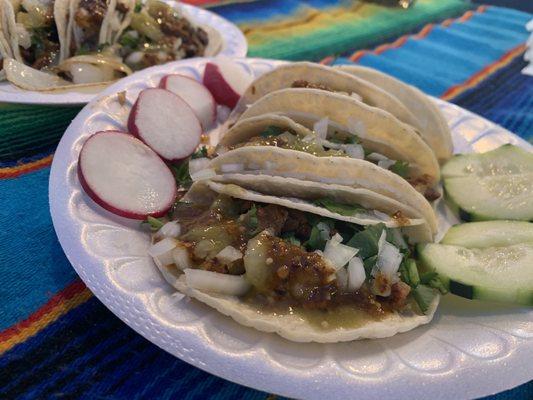 Street tacos with cilantro and onions with hot/mild sauce