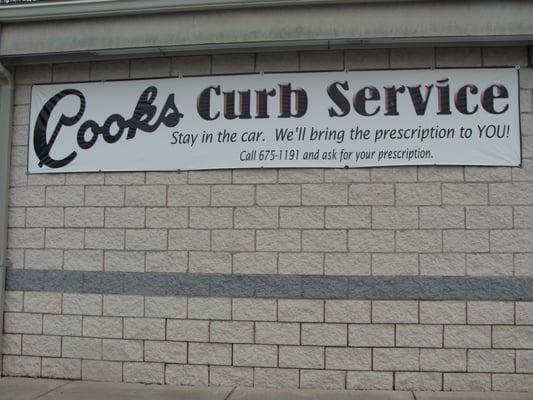 The side of Cook's Pharmacy, we have curb service available!