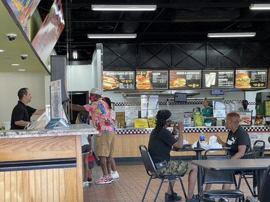 Great manager to the left. Awesomely dressed dad treating his kids for ice cream