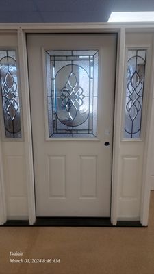 Smooth fiberglass door with Brigantine glass and side lights