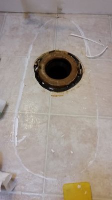 Old toilet was caulked to the floor so I cleaned up that mess before the new one went in.