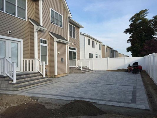 Pavered patio with matching steps, pvc railings.