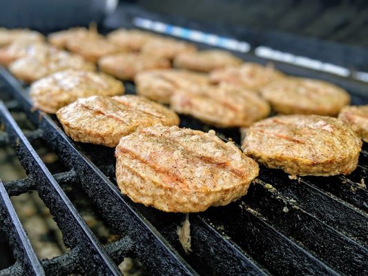 Shoup's Signature Porkburgers Sizzling on the grill