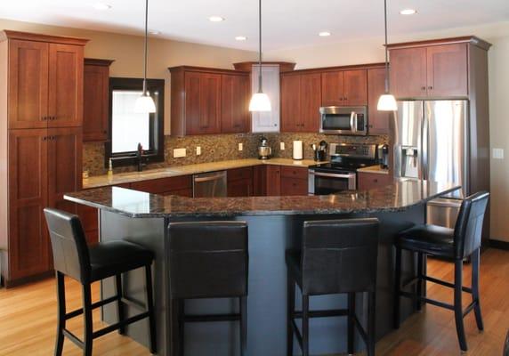 Omega cabinetry, Quartz counter tops, Cherry wood, Canyon stain.