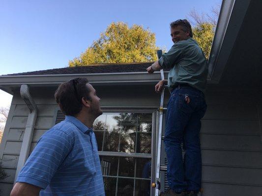 Scott Maury explaining the importance of gutters to the client  during the inspection !