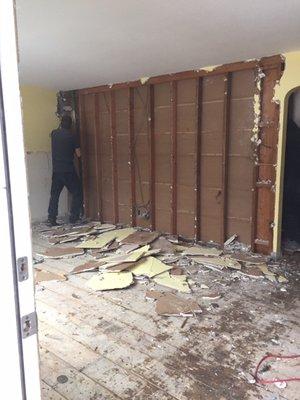 stripping down the sheetrock, but making sure to protect the load bearing wall