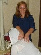 Dawn performs chair massage at an on-site event