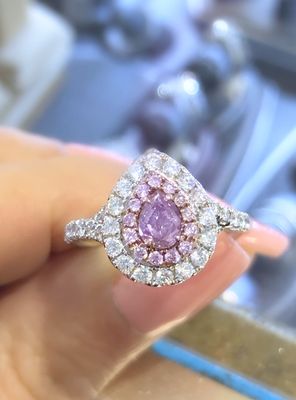 Natural fancy pink diamond pear shape ring with halo