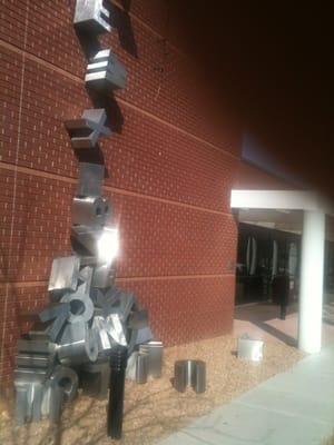 Letters falling off roof.