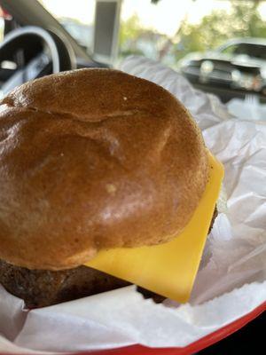 Beyond burger with a cold slice of cheese