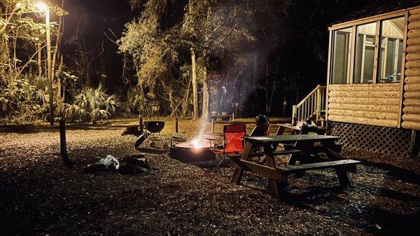 Enjoying a bonfire outside of our cabin.