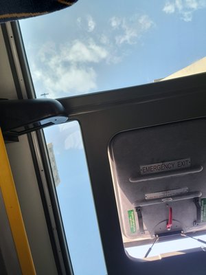 This emergency exit above head was opened after half journey.