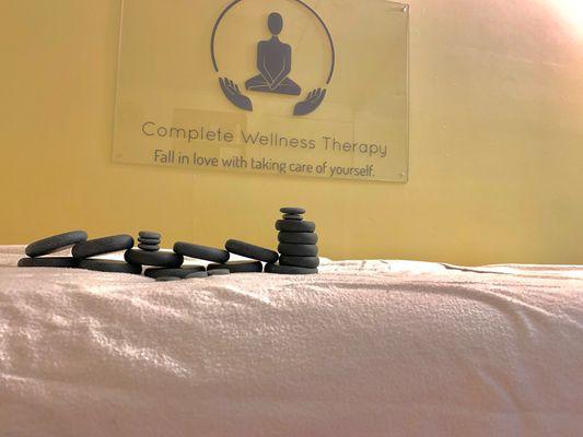 Hot stone therapy offered in studio only