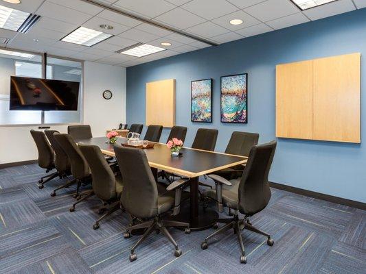 Our extended Large Conference Room allows 10-12 people to sit comfortable at and executive table. Complete with two TV's, & two whiteboards