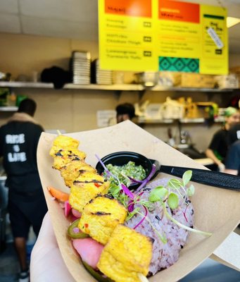 Lemongrass Turmeric Tofu! Comes with purple sticky rice and pickled veggies. Best food I've eaten at the fair.