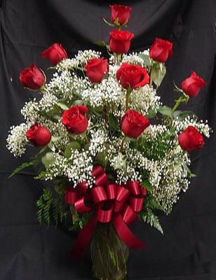 Dozen Red Freedom Roses in a vase