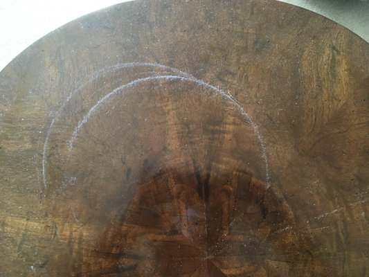 Rings of dust on a coffee table discovered after they had come to clean.