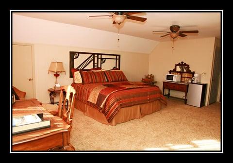 The Loft Suite has its own entrance and has a king bed, microwave, frig, desk, lounge and love seat. small shower bathroom.