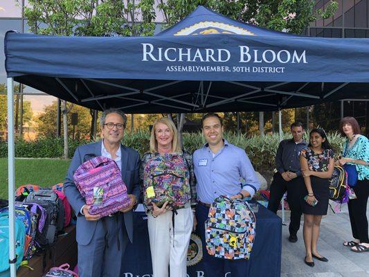 Donating to a back to school fundraiser with Richard Bloom. It was great giving back.